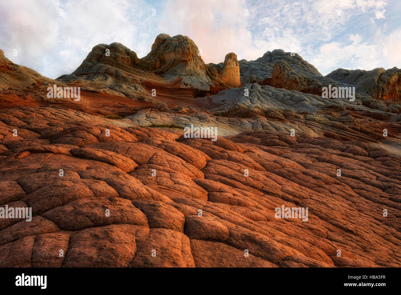 Sunset glow on the cross bedding brain rock and sandstone formations in Arizona's remote White Pocket  and Vermilion Cliffs National Monument. Stock Photo