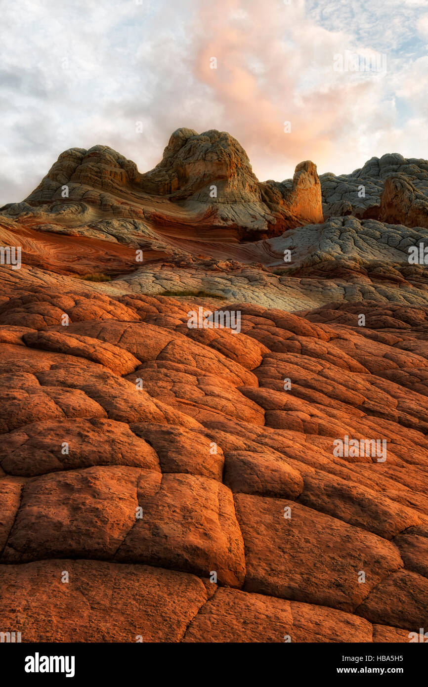 Sunset glow on the cross bedding brain rock and sandstone formations in Arizona's remote White Pocket  and Vermilion Cliffs National Monument. Stock Photo