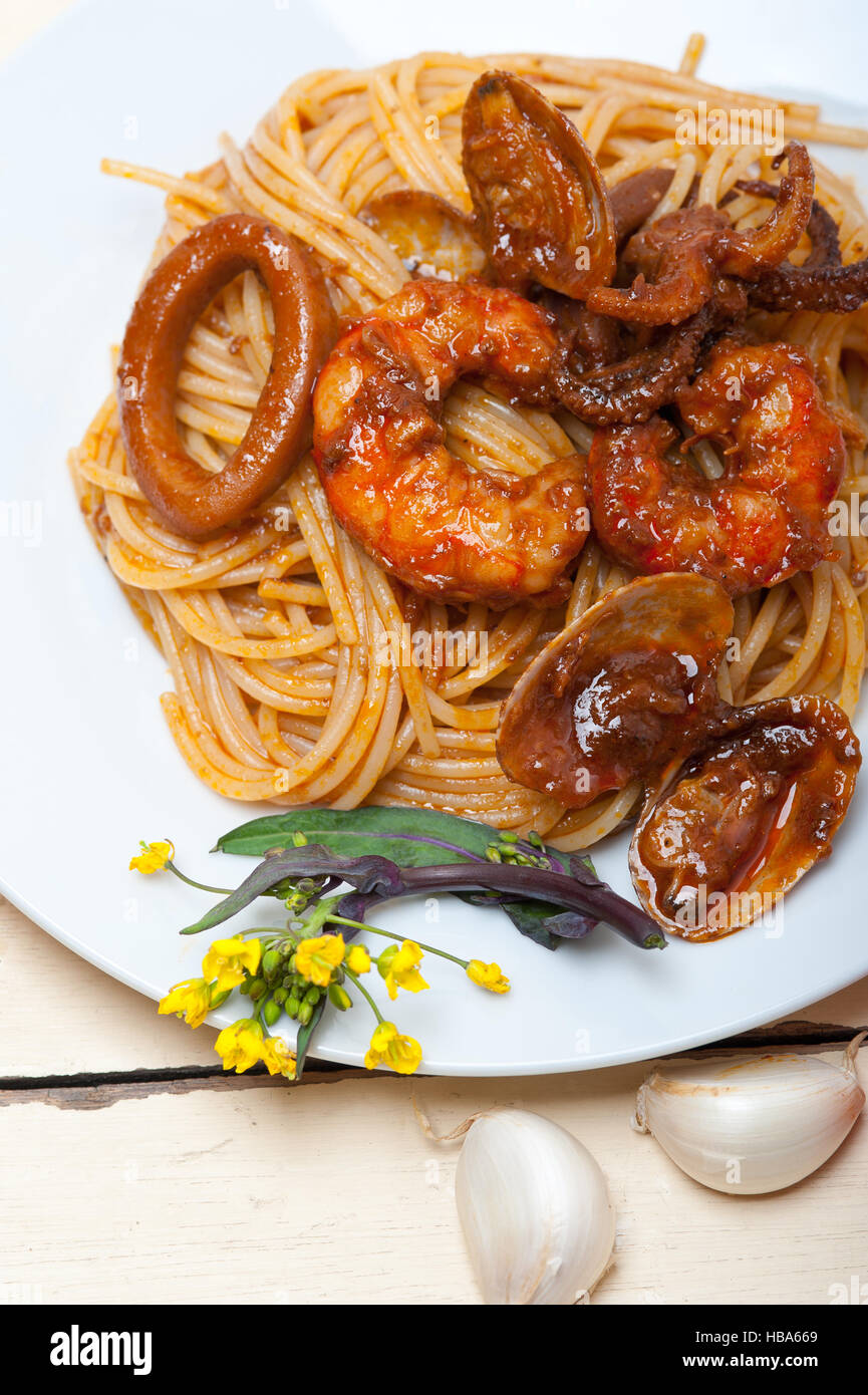 Italian seafood spaghetti pasta on red tomato sauce Stock Photo - Alamy
