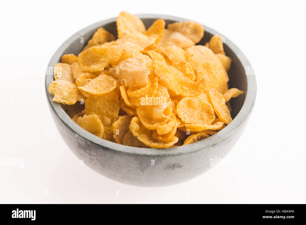 Corn flakes on white background Stock Photo Alamy