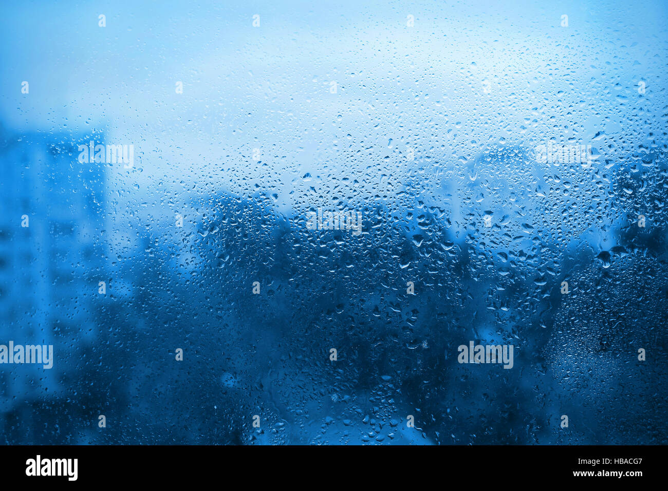 Natural drops of water on window glass Stock Photo