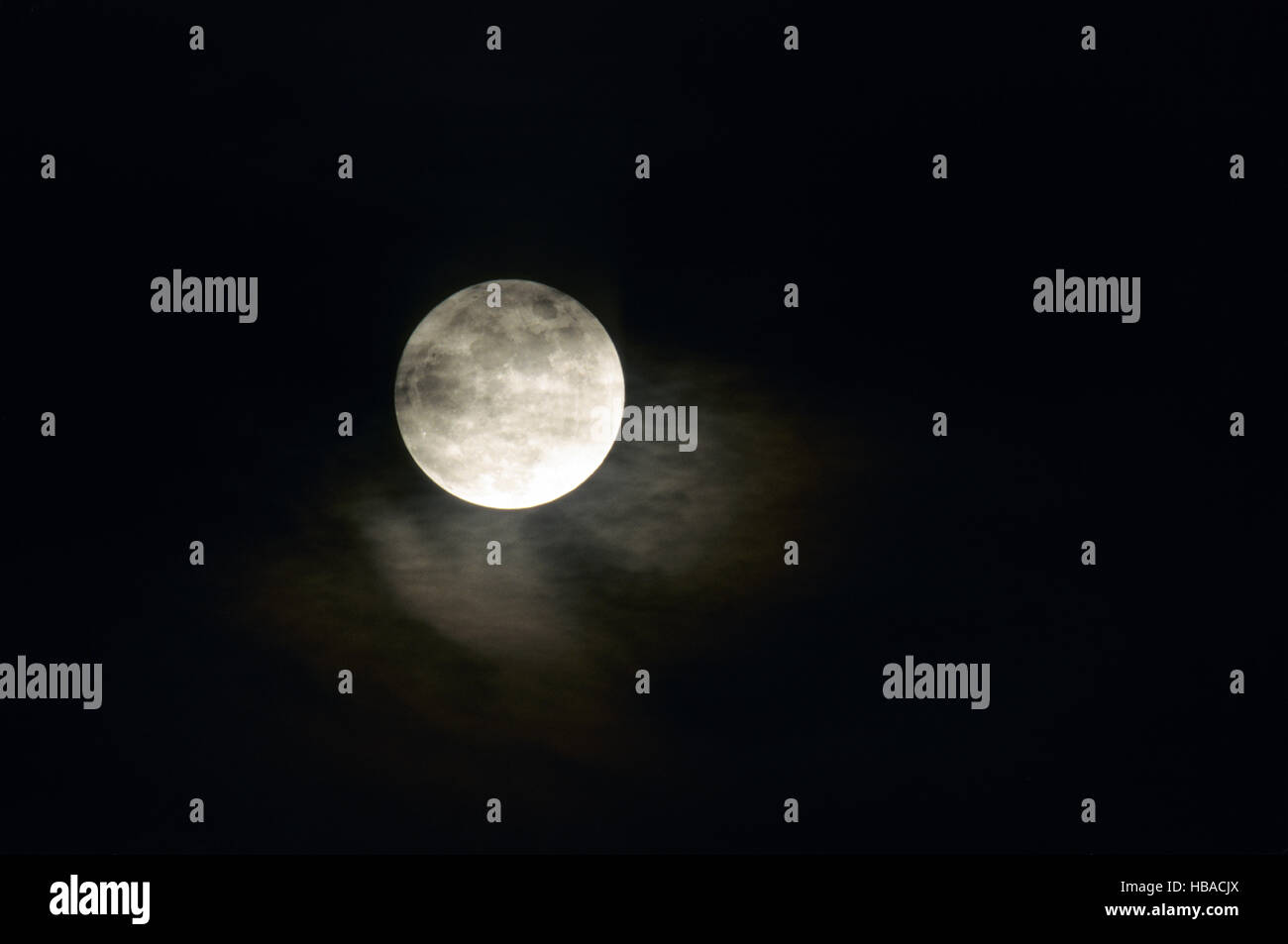 Full moon and clouds in the night sky Stock Photo