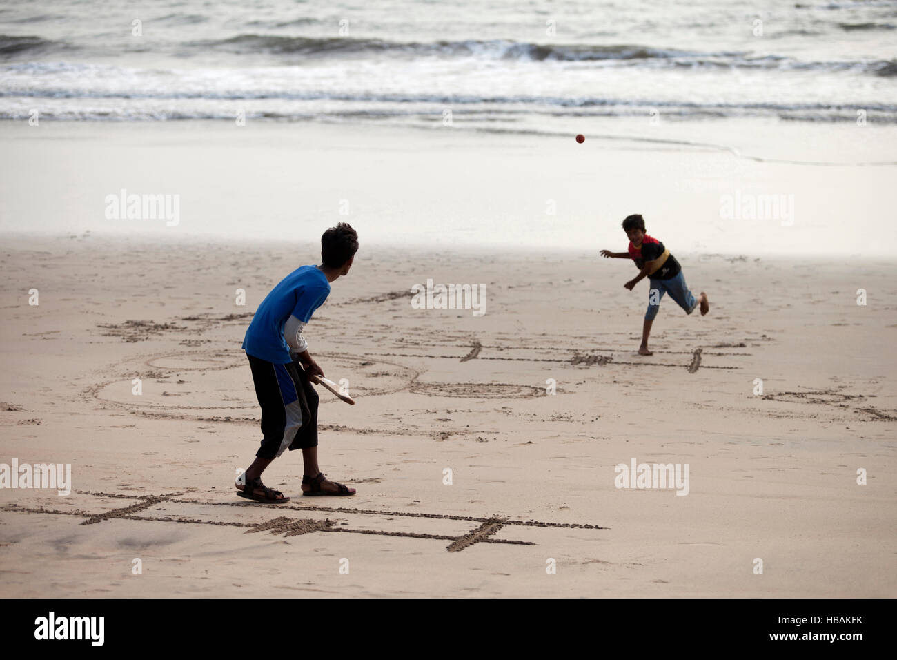 Boys playing cricket on beach, Diveagar, Maharashtra, India Stock Photo
