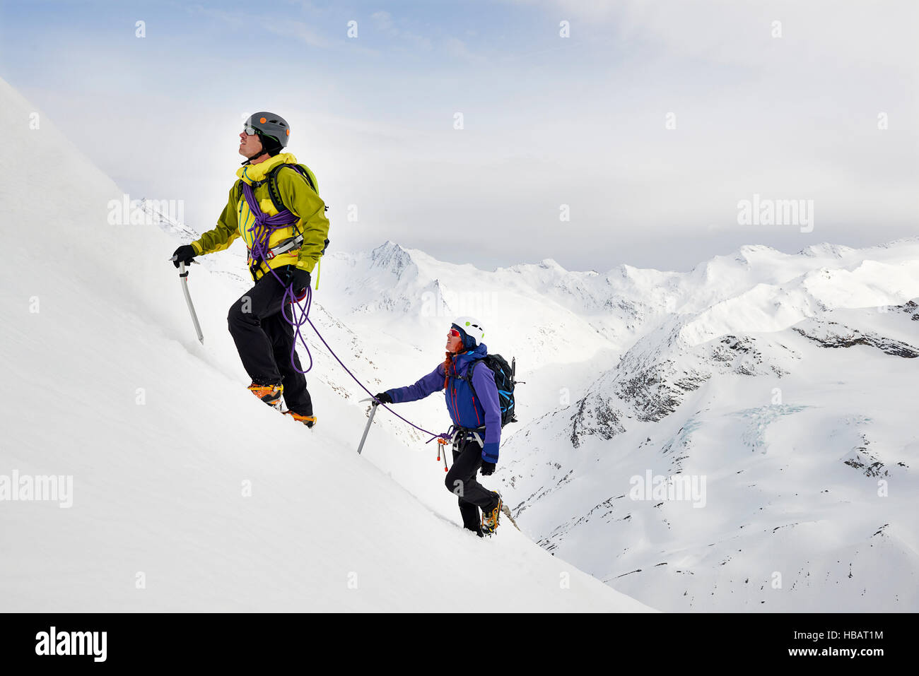 Mountaineers ascending snow-covered mountain, Saas Fee, Switzerland Stock Photo