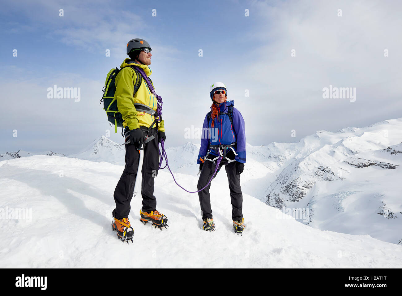 Mountaineers on top of snow-covered mountain looking away, Saas Fee, Switzerland Stock Photo