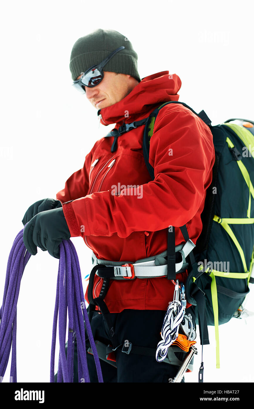 Mountaineer preparing climbing ropes Stock Photo Alamy