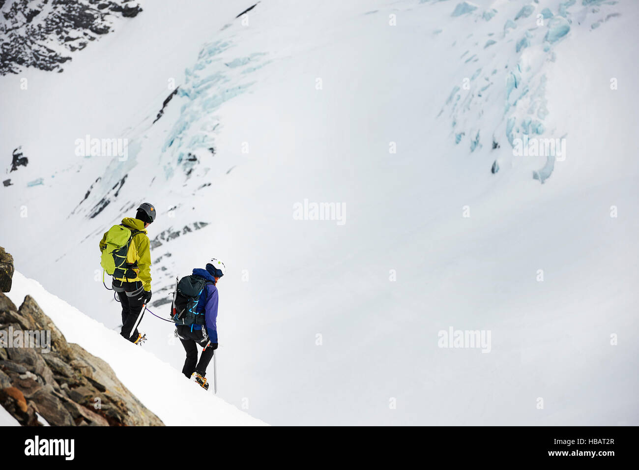 Mountaineers ski touring on snow-covered mountain, Saas Fee, Switzerland Stock Photo