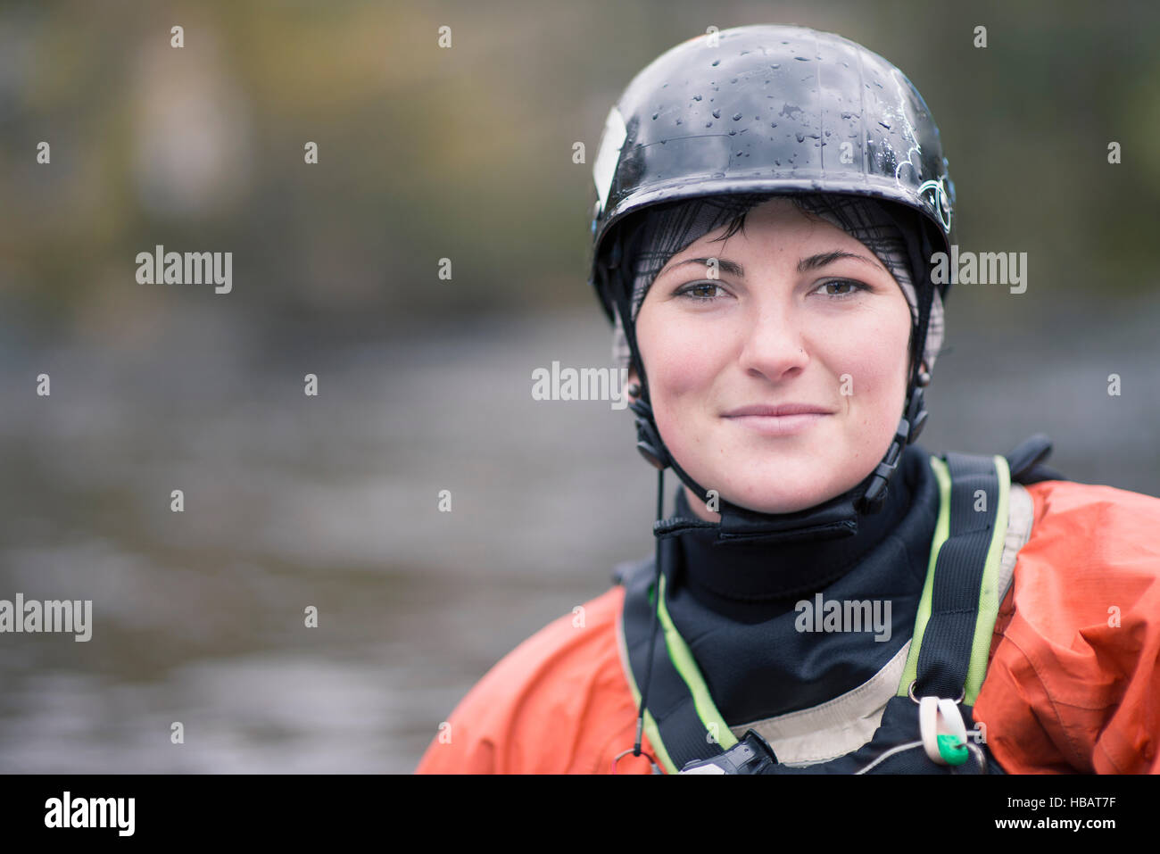 Portrait of young female kayaker in watersports helmet Stock Photo