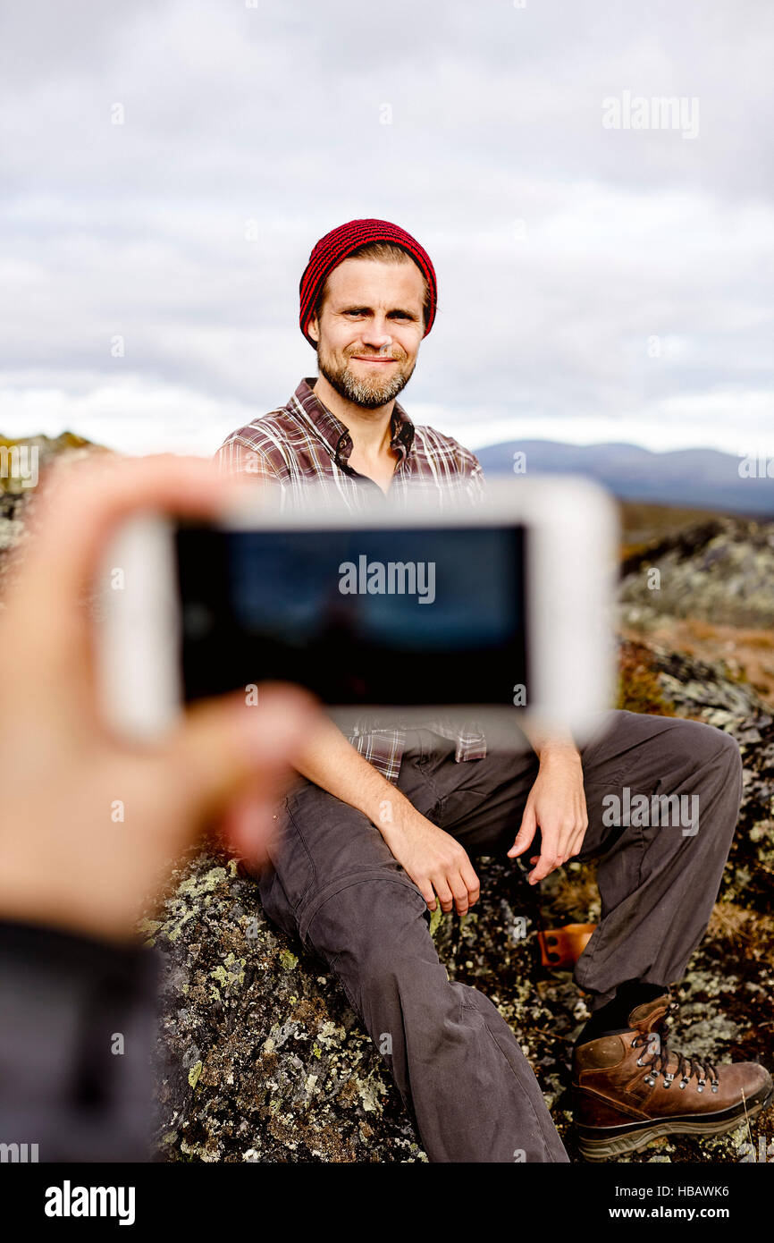 People sitting on cliff top hi-res stock photography and images - Alamy