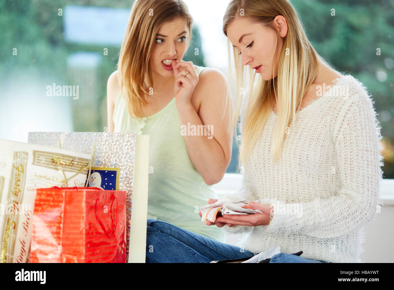 Two girls looking overspent with their shopping Stock Photo