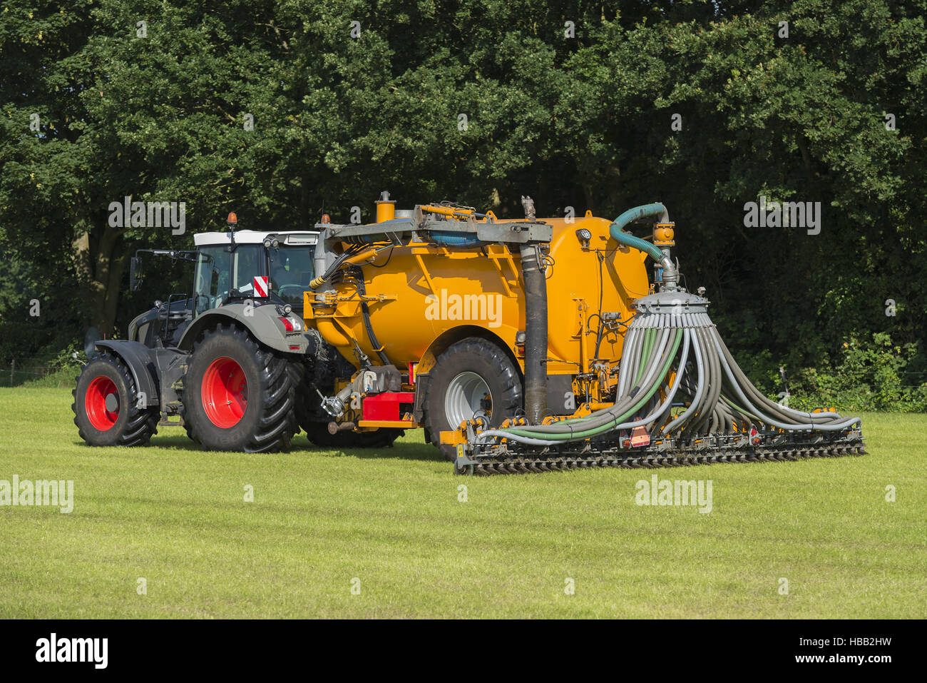 injecting manure in a pasture Stock Photo