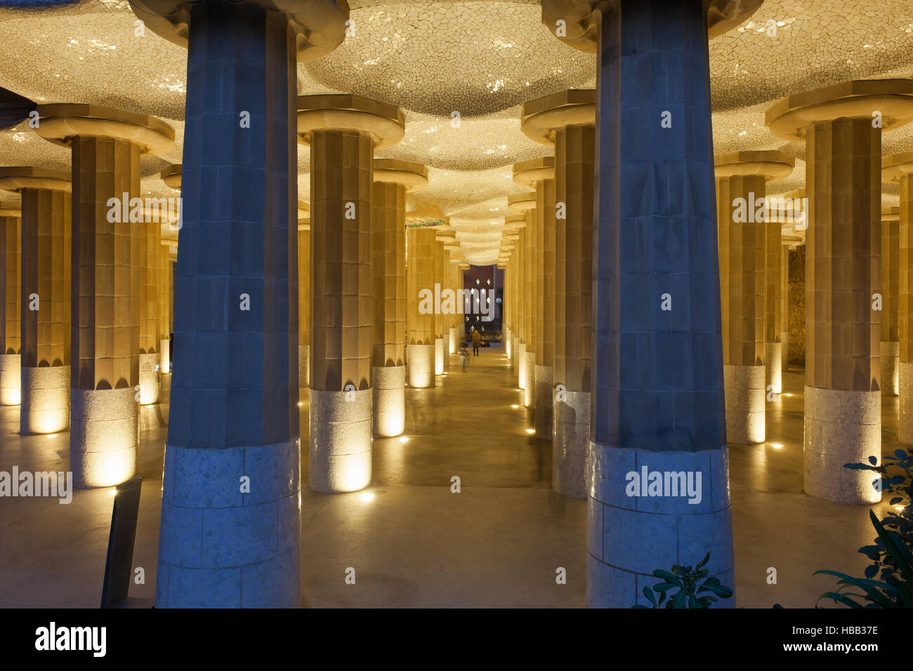 Spain, Catalonia, Barcelona, Park Guell, columns in Hypostyle Room illuminated at night Stock Photo