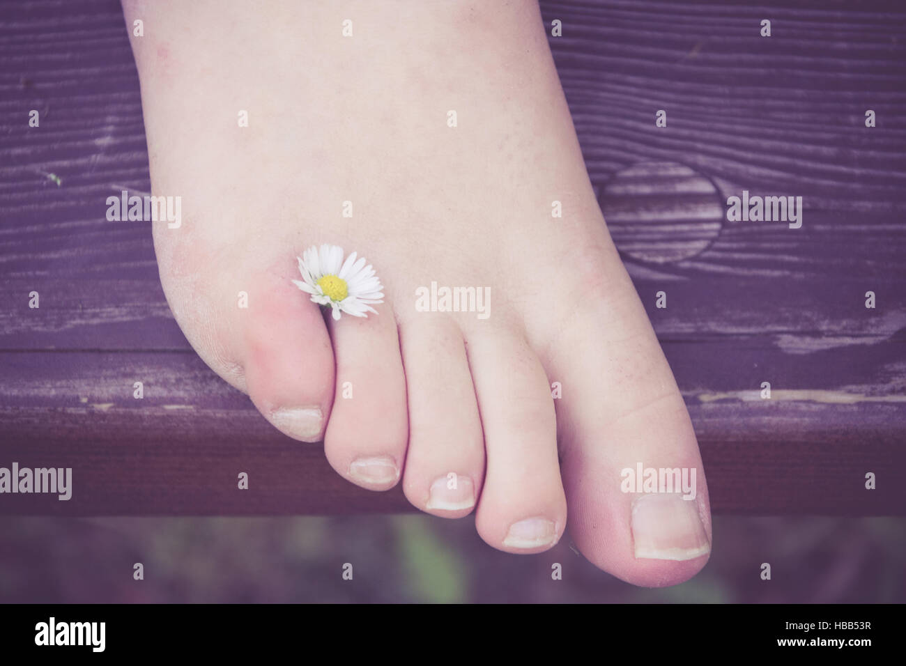 Barefoot with flower Stock Photo