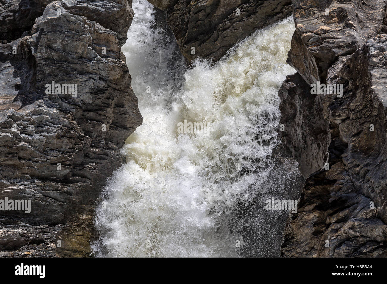 Waterfall Flowing Between the Lava Stones Stock Photo