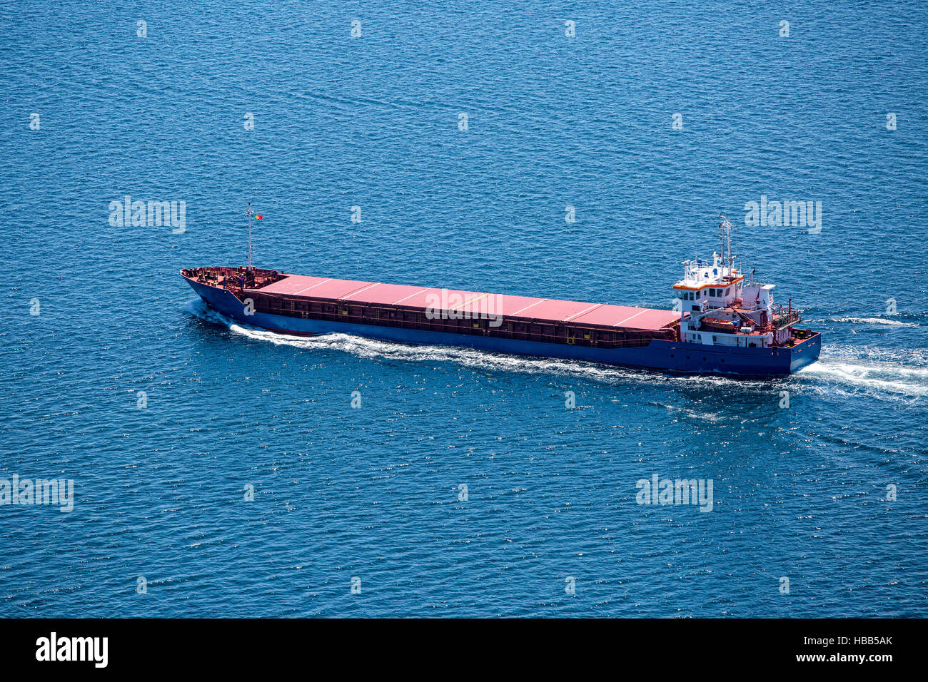 Cargo Ship Sailing in the Atlantic Ocean Stock Photo