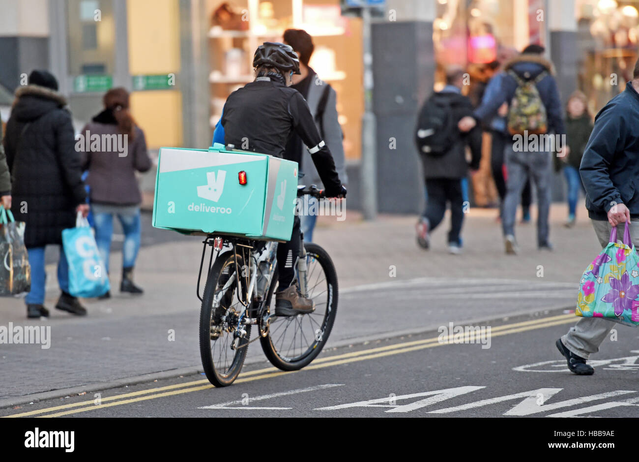 Deliveroo cyclist on streets of Brighton UK Stock Photo