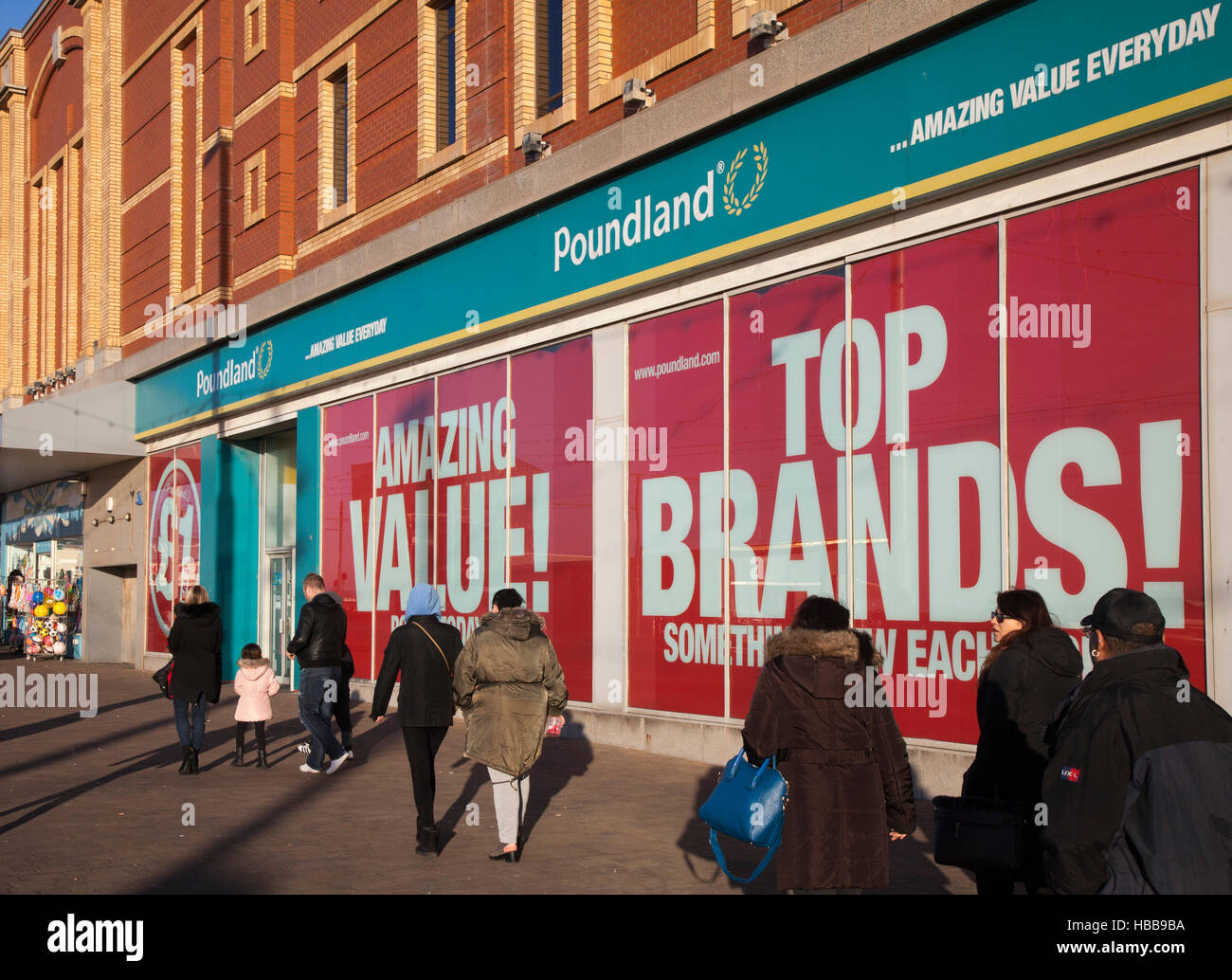 Poundland store on the Golden Mile, Blackpool seaside resort, shops and shoppers in the resort, Lancashire, UK Stock Photo