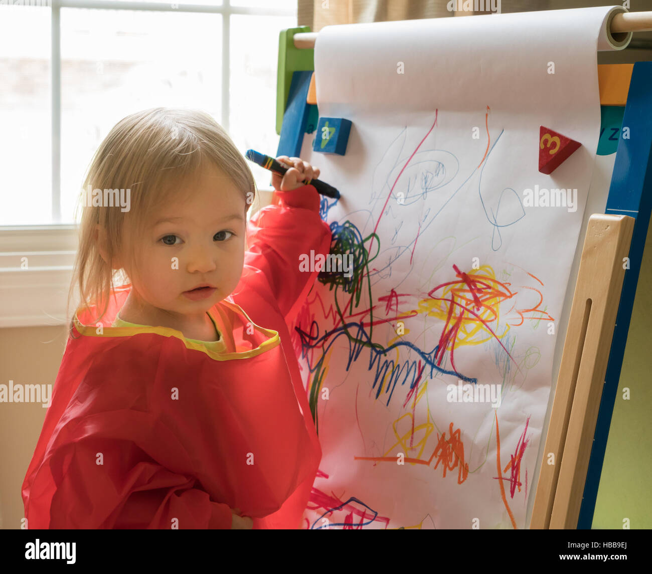 Young Baby Girl Drawing At Easel Stock Photo Alamy Young Baby Girl Drawing At Easel Stock Photo Alamy