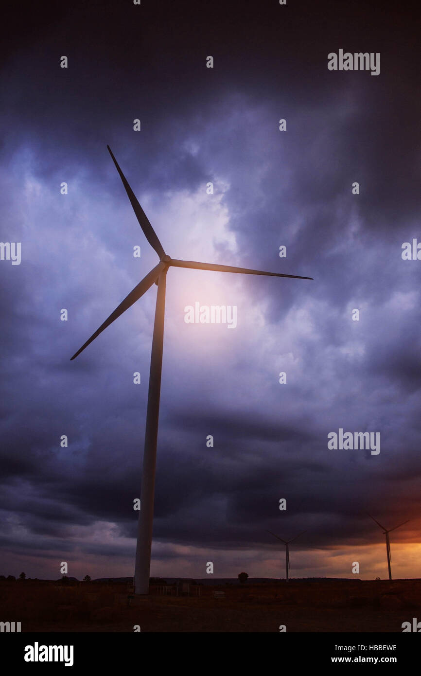 Wind turbines with a dark sky in the evening Stock Photo - Alamy
