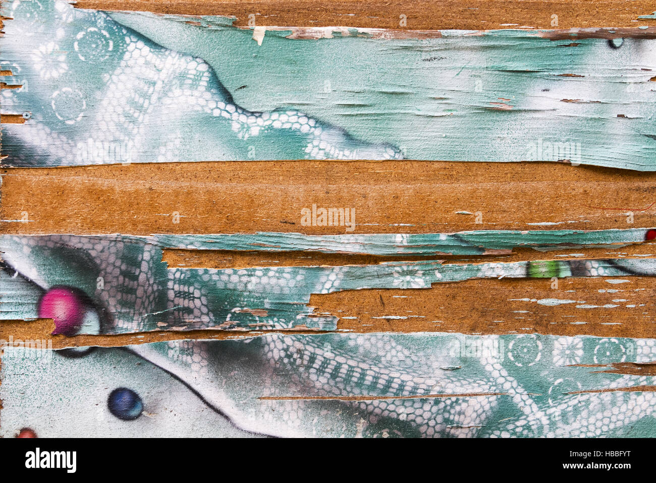 Graffiti on flaking wooden surface Stock Photo