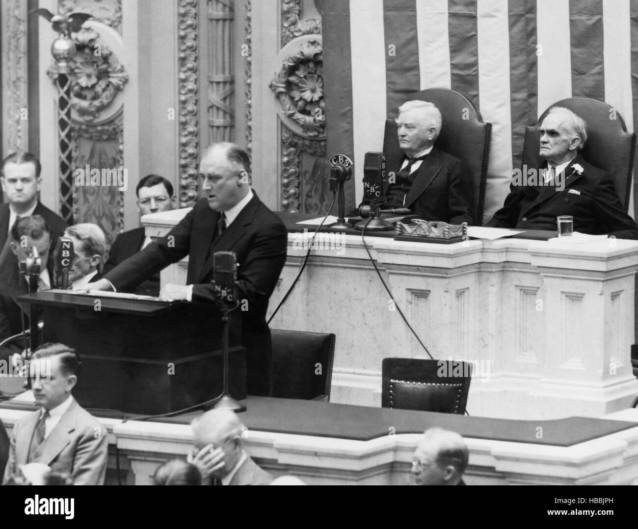 President Franklin D. Roosevelt (left of center), delivering his veto