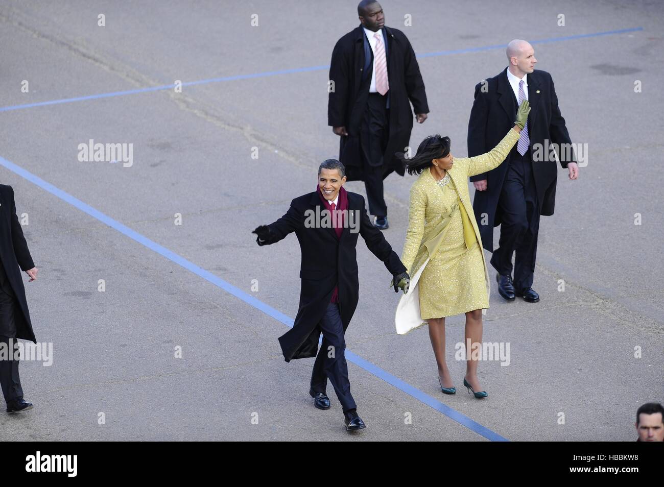President and Michelle Obama wave to the crowd along Pennsylvania Avenue during the 2009 presidential inaugural parade. Jan. 20 Stock Photo