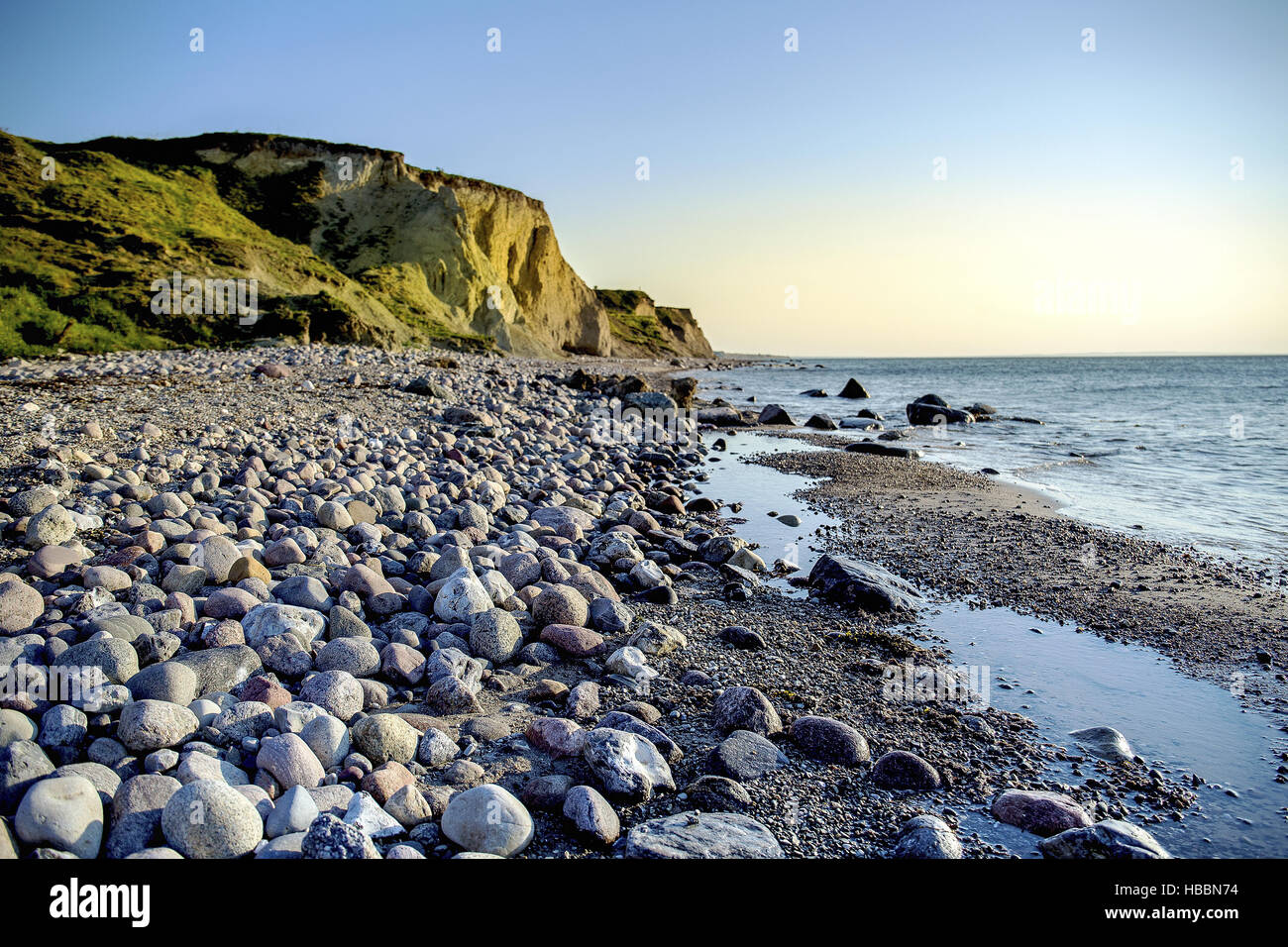 steep coast in sunset Stock Photo - Alamy