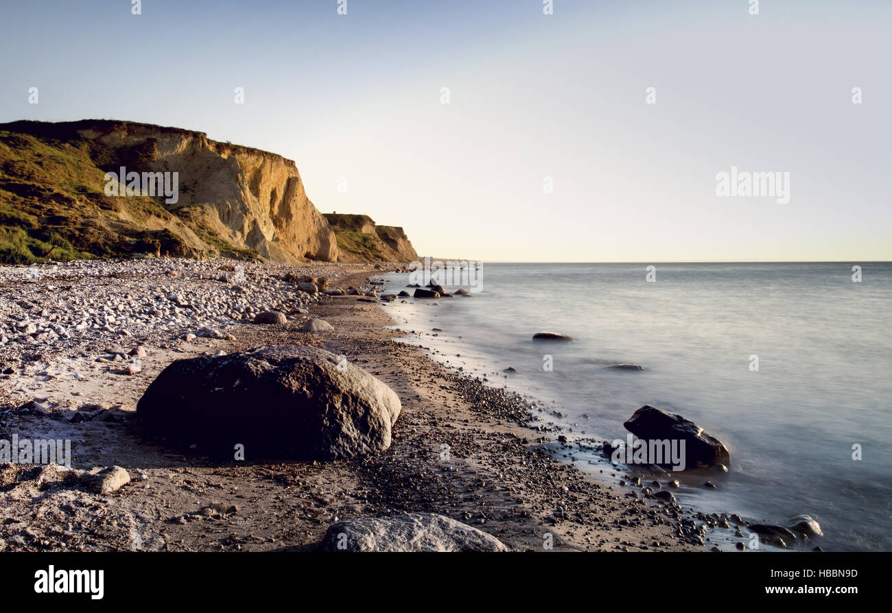 steep coast in sunset Stock Photo - Alamy