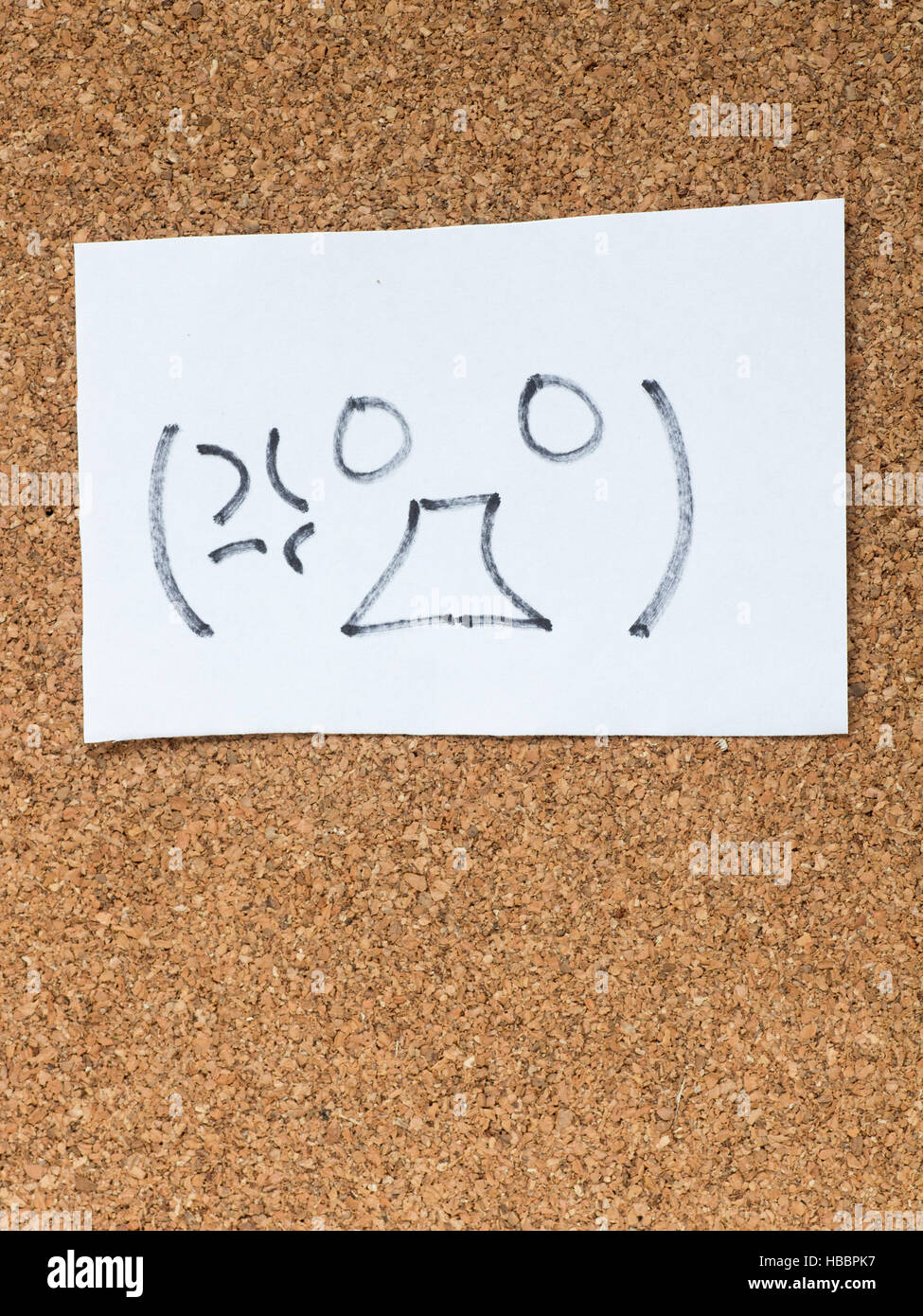 The series of Japanese emoticons called Kaomoji on the cork board, angry Stock Photo