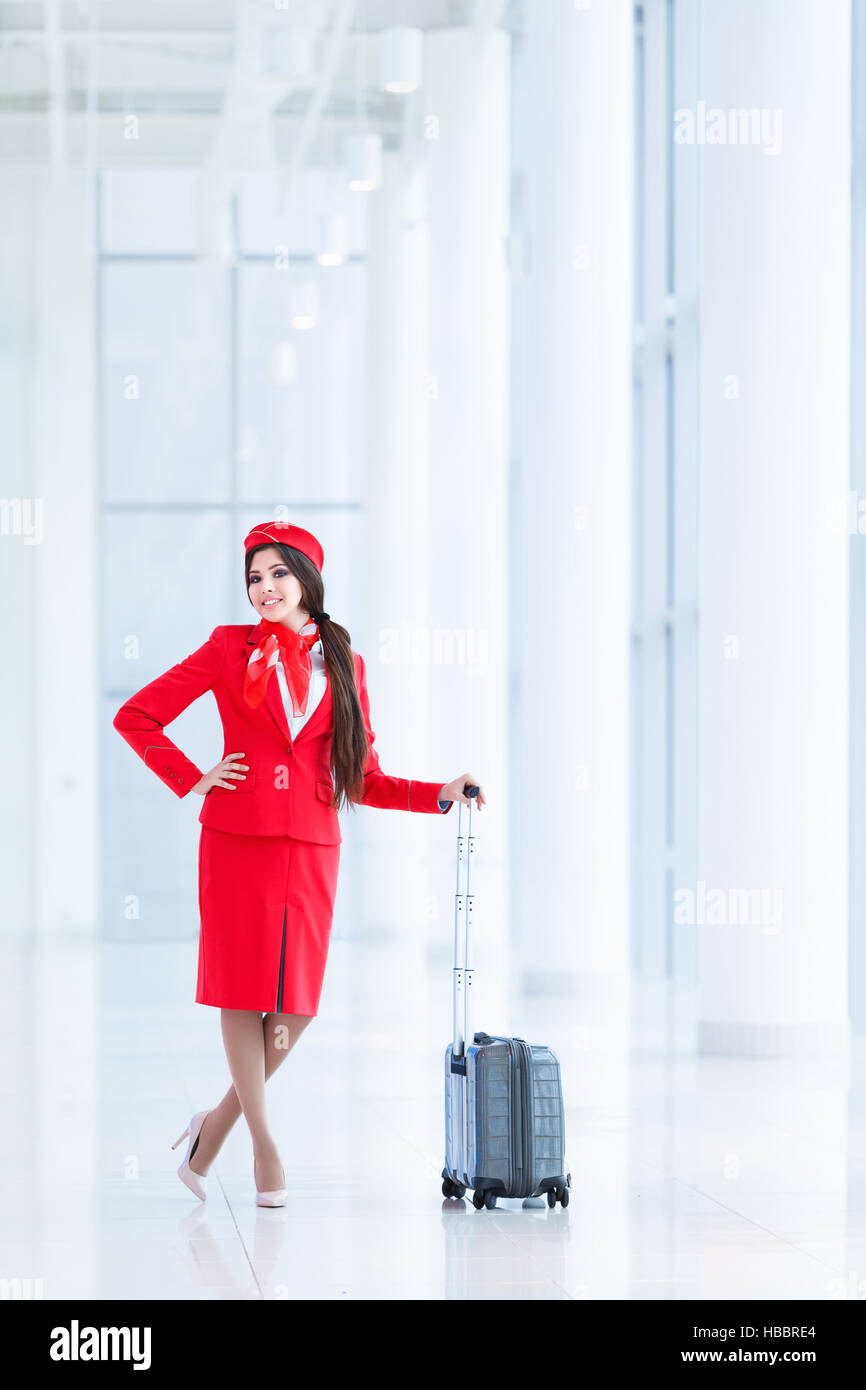 Stewardess with luggage Stock Photo Alamy