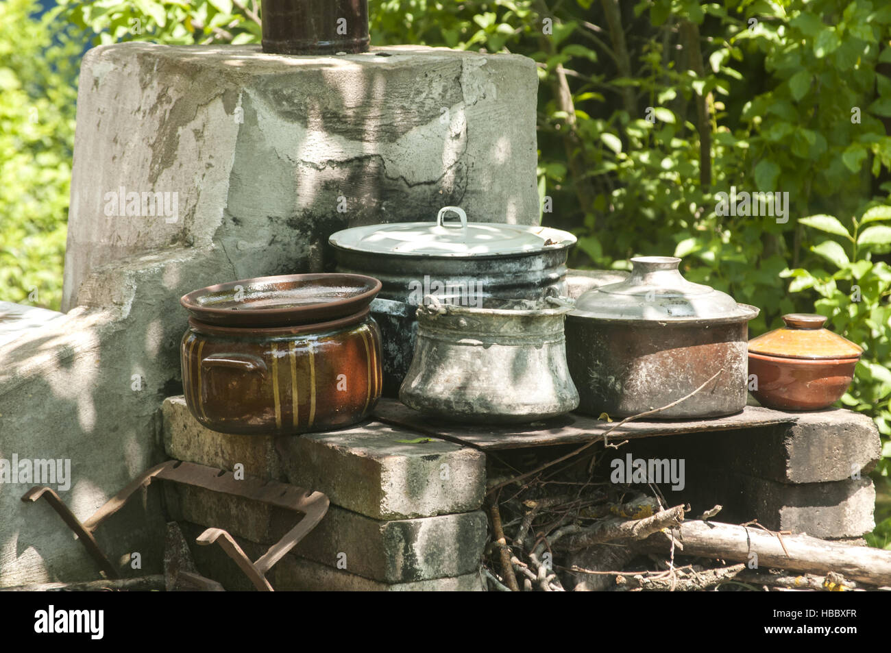 Outdoor fireplace with pots Stock Photo