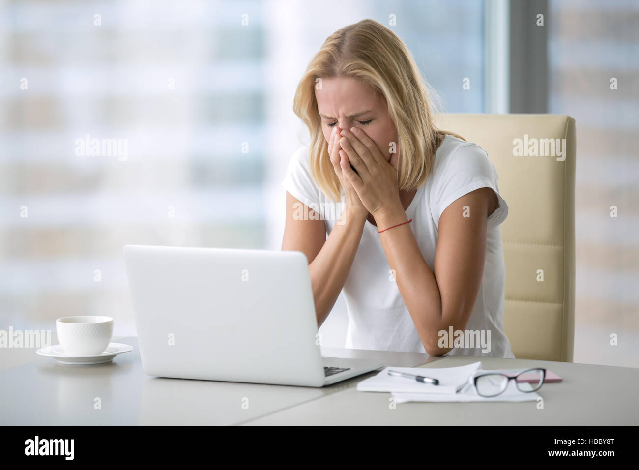 Young woman covering her face Stock Photo