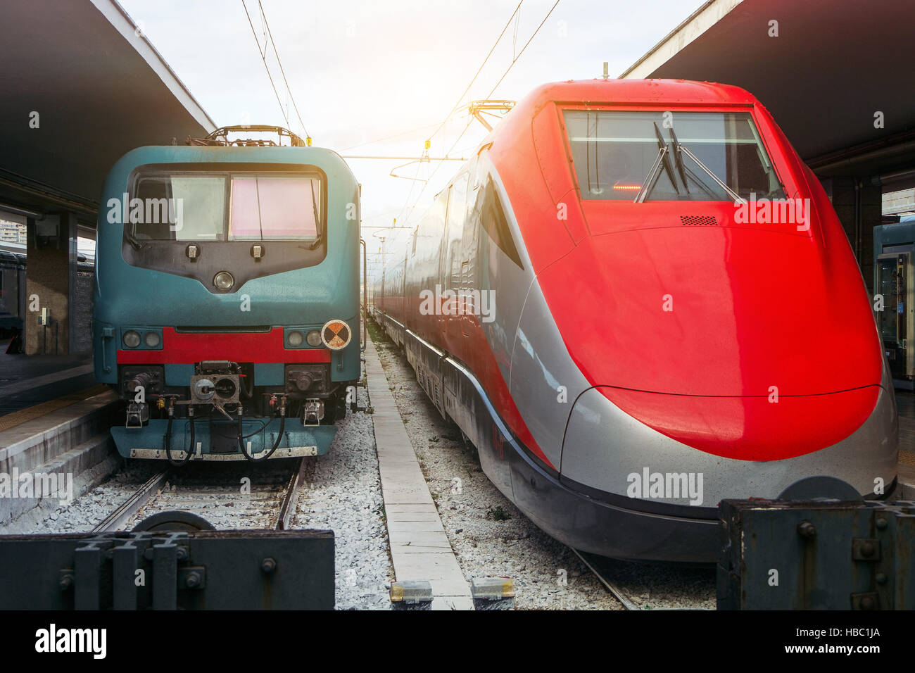Two modern train engines in a train station Stock Photo Alamy