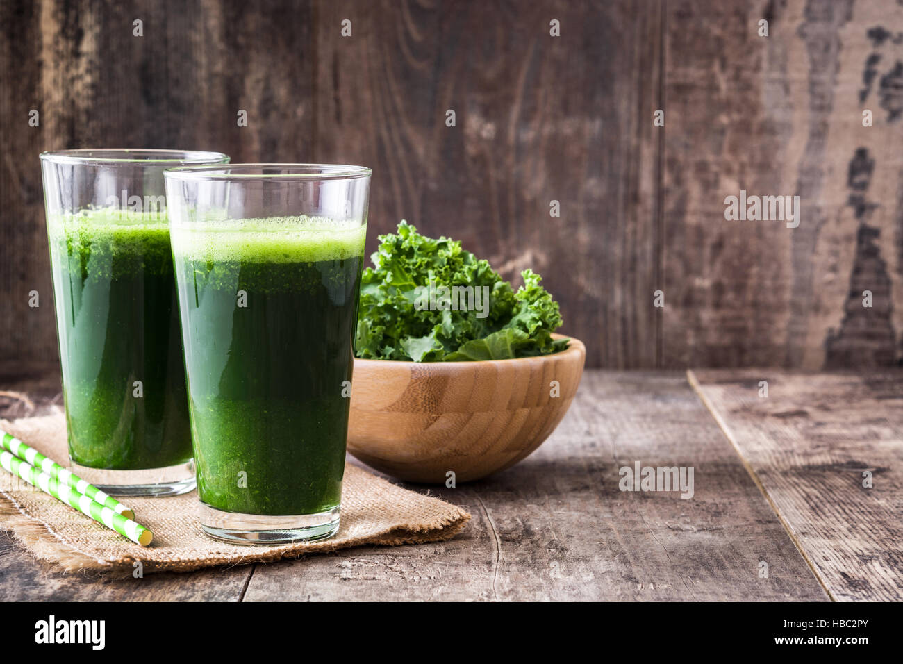 Kale smoothie in glass on wooden background.Copyspace Stock Photo - Alamy