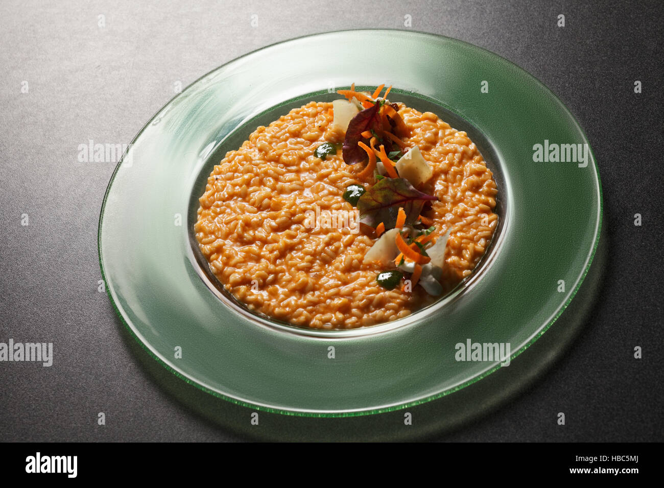 Risotto parmigiano on a tabletop Stock Photo