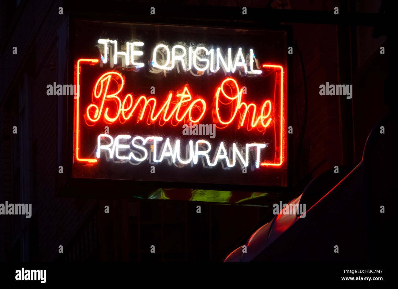 Neon sign outside The Original Benito One, an Italian restaurant on Mulberry Street in Little Italy in New York City Stock Photo
