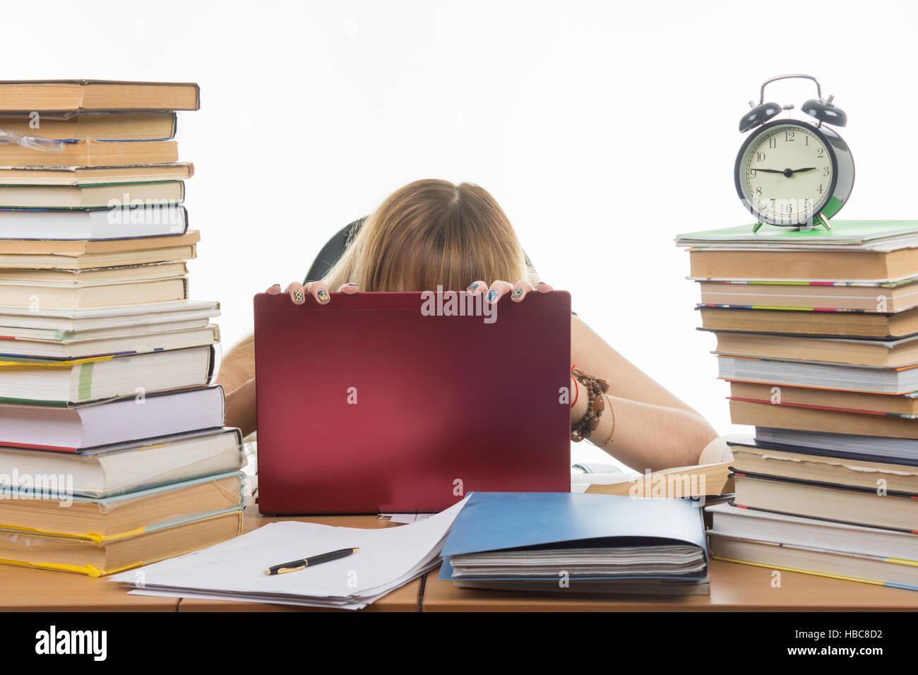 Student in despair laid her head on laptop Stock Photo