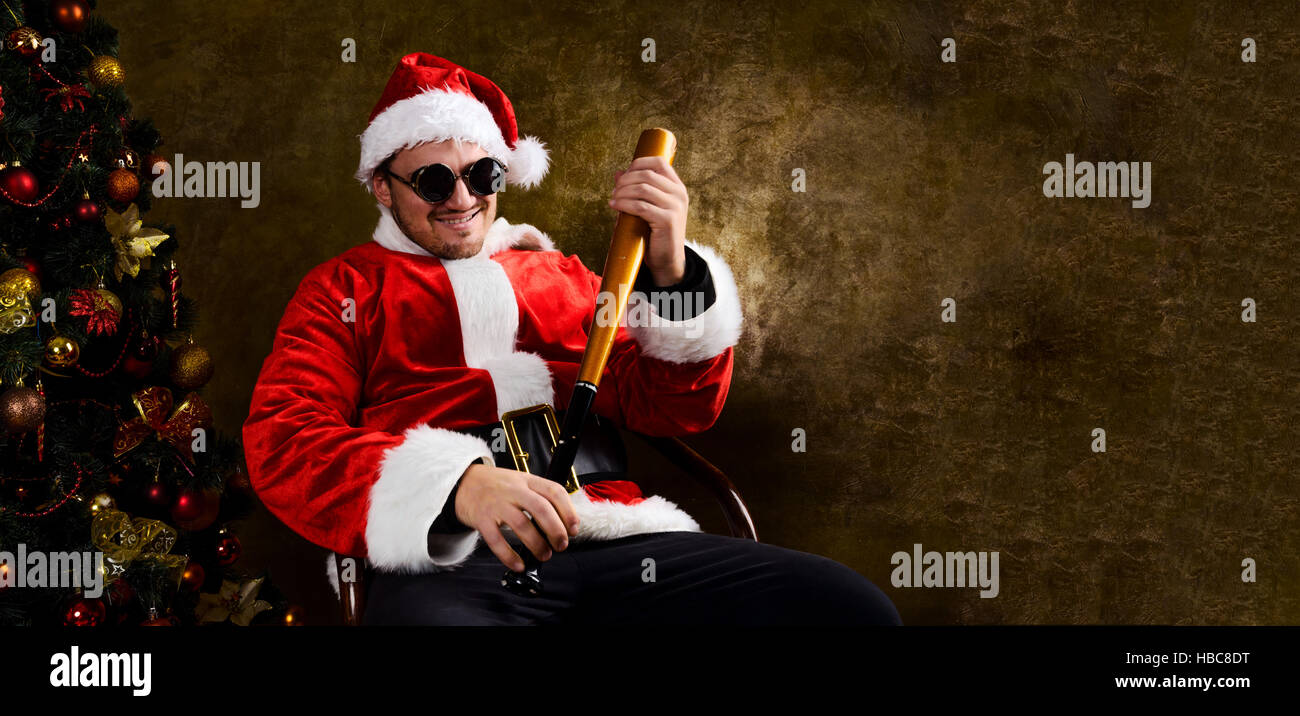 Bad Santa with baseball bat Stock Photo