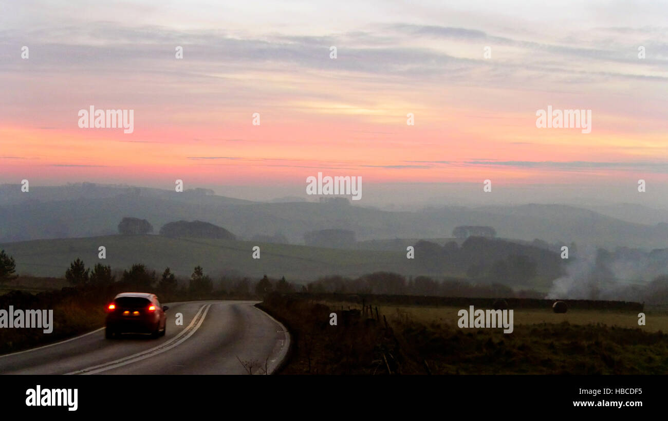 Derbyshire, UK. 5th Dec, 2016. UK Weather: amazing red sunset on a cold misty foggy evening from the A515 between Buxton & Ashbourne in the Peak District National Park, Derbyshire Credit:  Doug Blane/Alamy Live News Stock Photo