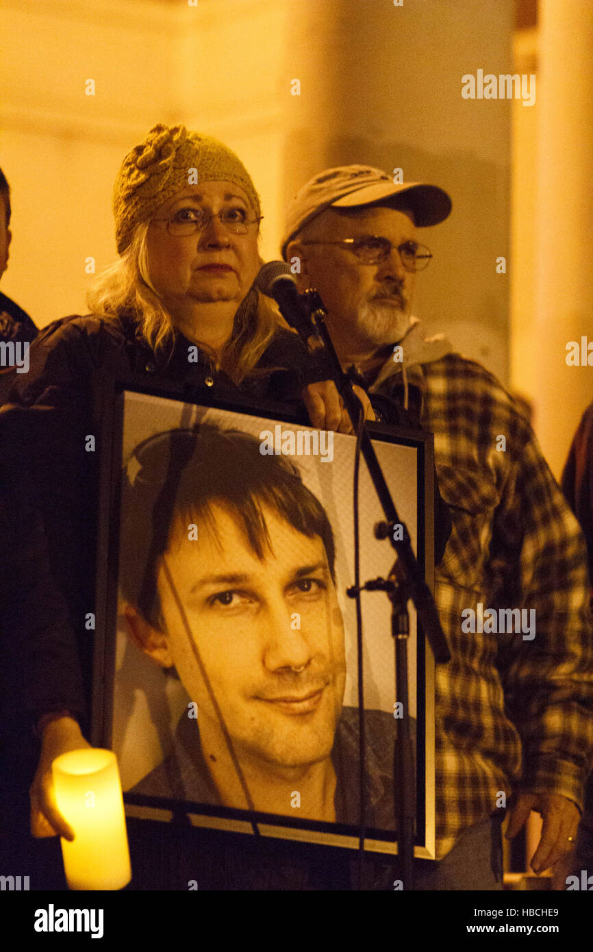 Oakland, USA. 05th Dec, 2016. People raise candles during a moment of silence at a vigil for victims of the Ghost Ship warehouse fire. Credit:  John Orvis/Alamy Live News Stock Photo