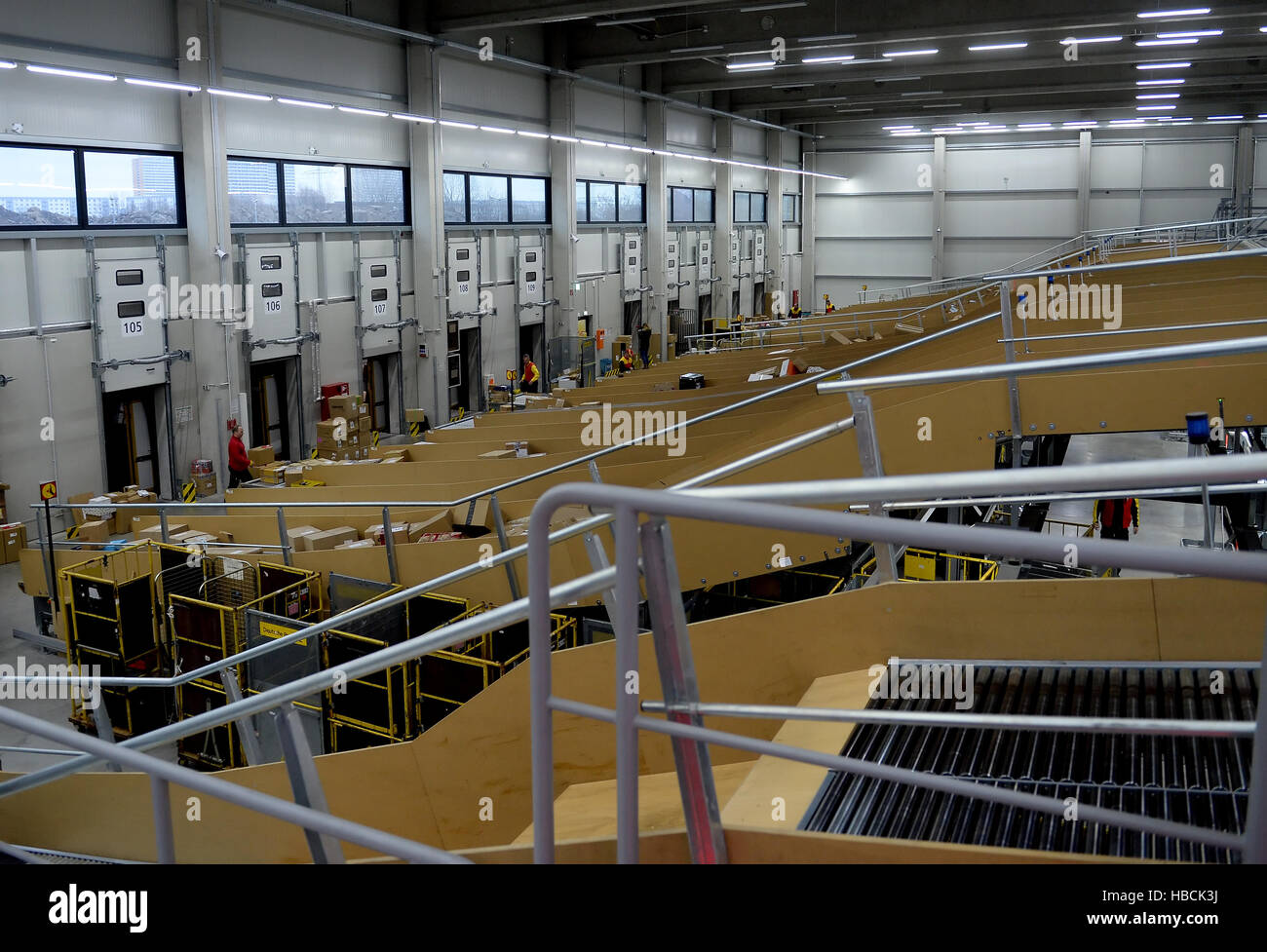 Packages are transported on conveyor belts in the DHL delivery centre