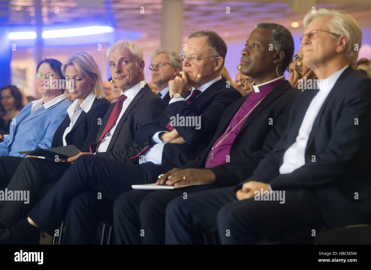 Matthias Mueller (3-L), Chairman of Volkswagen AG, his wife Barbara Rittner (2-L), The Premier of Lower Saxony Stefan Weil (C), the archbishop of Cape Town Thabo Makgoba (2-R), and Heinrich Bedford-Strohm, Chairman of the Council of the Evangelical Church of Germany (EKD) at a discussion forum sponsored by the Evangelical Church of Hanover in the car-manufacturing city of Wolfsburg. Germany, 06 December 2016. Representatives from the fields of politics, economy and religious convened to discuss the topics of work and vocation under the title 'Co-Creator Human: Rediscovering Work'. Photo: Julia Stock Photo