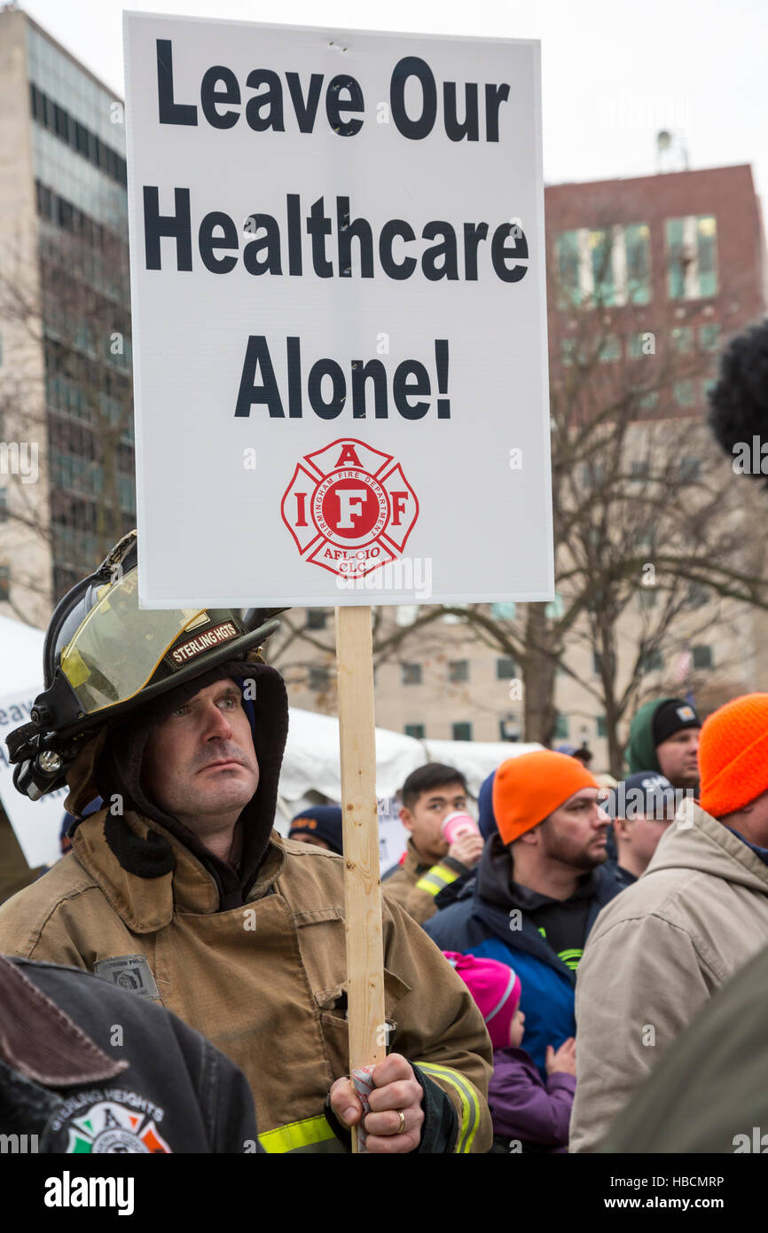 Michigan, USA. 6th December, 2016. Firefighters and police officers rally at the Michigan state capitol to protest bills in Michigan's Republican-controlled lame duck legislature that would scale back health benefits for active and retired employees. During the rally, union leaders announced that legislative leaders had agreed to shelve the bills until the 2017 legislative session. Credit:  Jim West/Alamy Live News Stock Photo