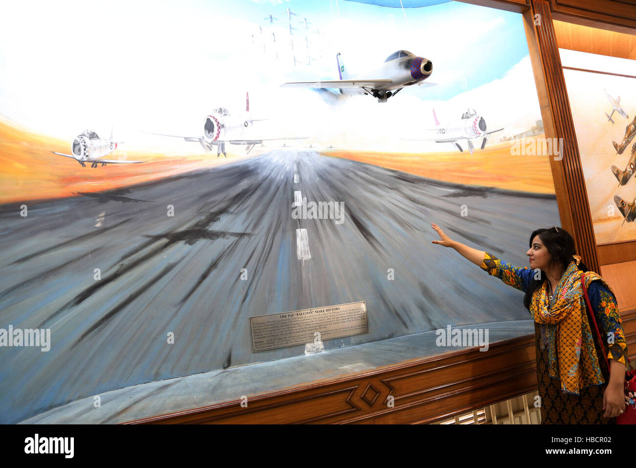 Karachi, Pakistan. 6th Dec, 2016. A visitor views a painting in the Pakistan Air Force Museum in Karachi, south Pakistan, Dec. 6, 2016. The museum was established in 1990 in two disused hangars. © Ahmad Kamal/Xinhua/Alamy Live News Stock Photo