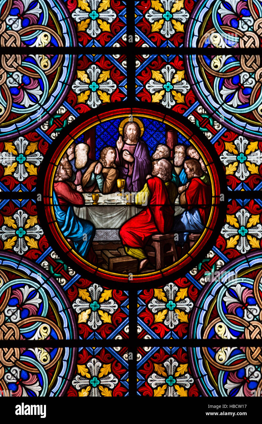 A photograph of a colorful lead-light window inside the cathedral on the Rhine river in Basel, Switzerland. Stock Photo