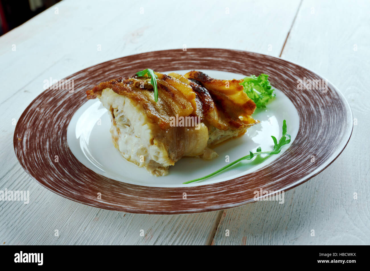 Baked cod wrapped in bacon Stock Photo Alamy