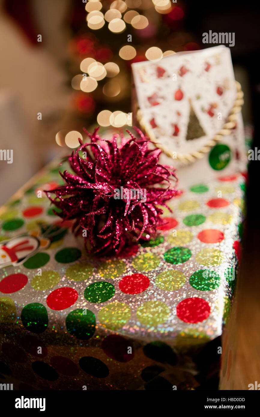 Ornately wrapped christmas gift Stock Photo