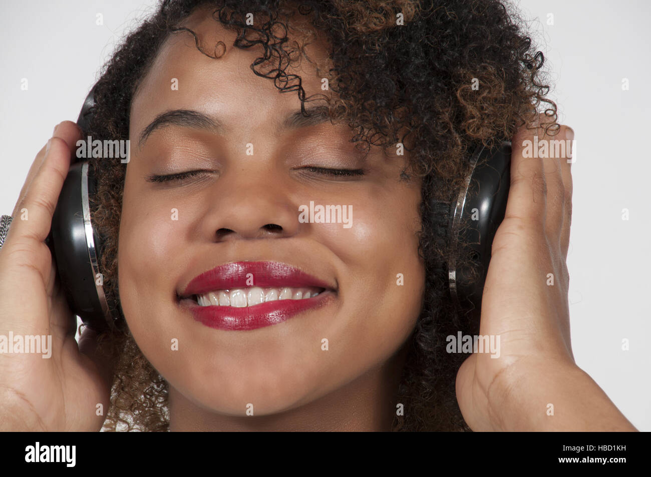Happy african women headphones hi-res stock photography and images - Alamy