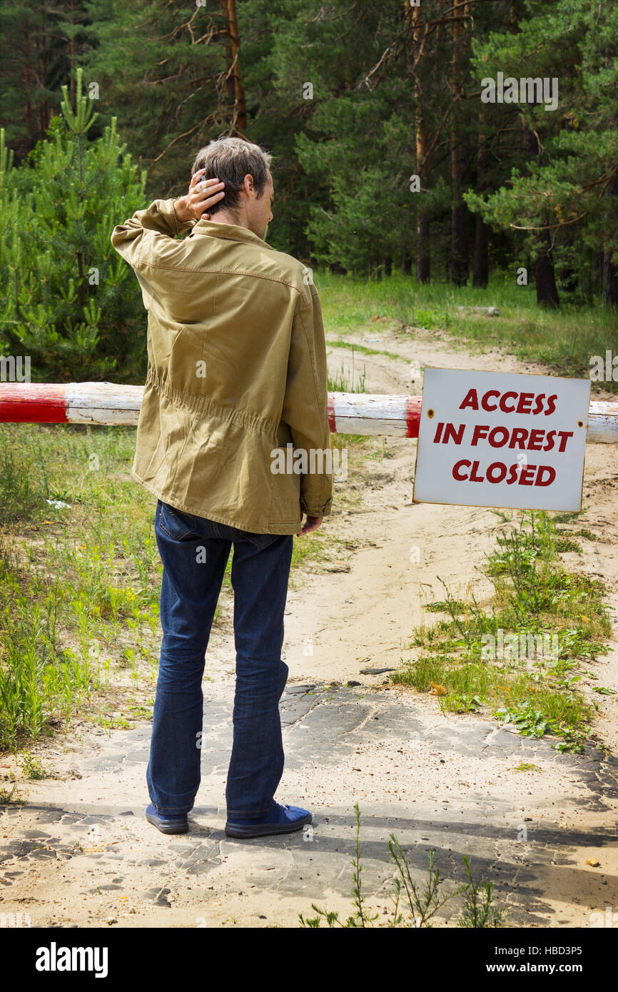 Young man reading banning attend forest Stock Photo