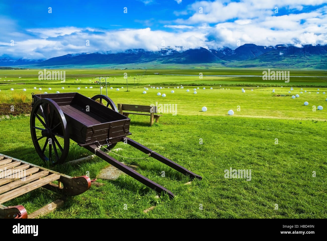 Old  two-wheeled cart on the lawn Stock Photo
